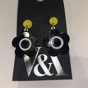 Black and yellow flower dangle earrings. New, still packaged.
